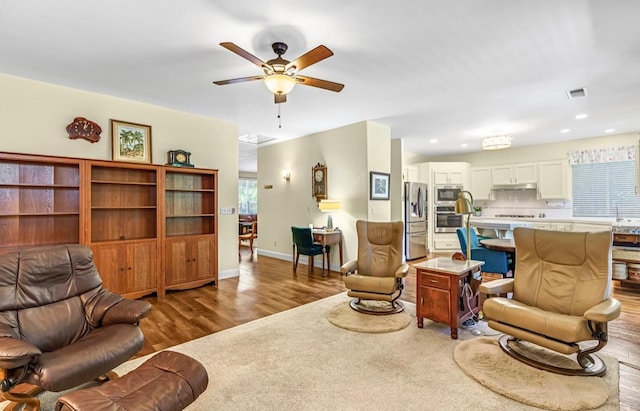 4632 W Minarets Ave, Fresno, CA 93722 - living room with a ceiling fan, wood finished floors, and recessed lighting