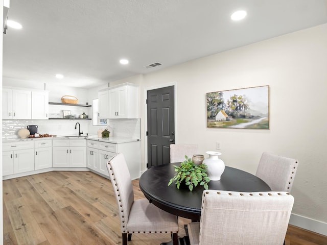 3844 E Holland Ave, Fresno, CA 93726 - dining space featuring light wood finished floors and recessed lighting