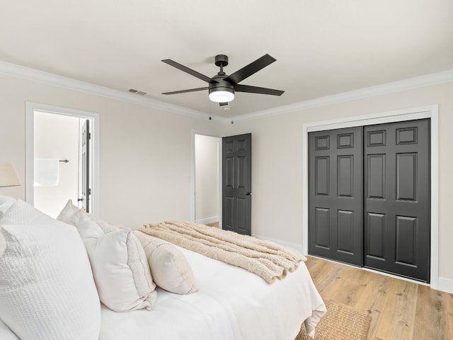 3844 E Holland Ave, Fresno, CA 93726 - bedroom with ornamental molding, light wood-type flooring, a closet, and ceiling fan