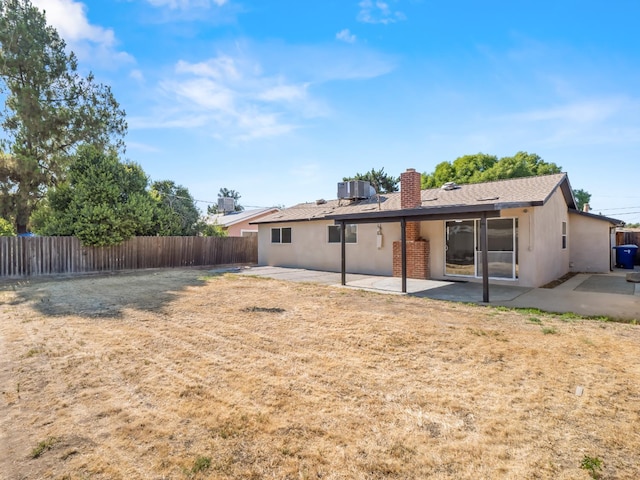 3844 E Holland Ave, Fresno, CA 93726 - back of property featuring a patio area, a chimney, stucco siding, and a shingled roof