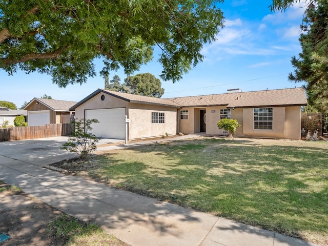 3844 E Holland Ave, Fresno, CA 93726 - ranch-style home with an attached garage, driveway, and stucco siding