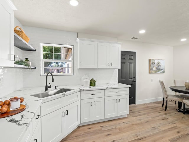 3844 E Holland Ave, Fresno, CA 93726 - kitchen featuring tasteful backsplash, recessed lighting, white cabinetry, open shelves, and light wood finished floors