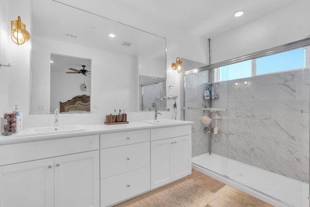 6569 E Lyell Ave, Fresno, CA 93727 - ensuite bathroom with double vanity, walk in shower, a ceiling fan, wood finished floors, and recessed lighting
