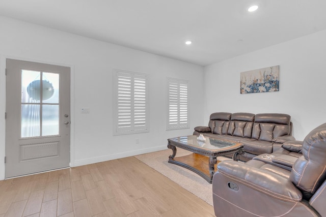 6569 E Lyell Ave, Fresno, CA 93727 - living area featuring light wood-style floors and recessed lighting