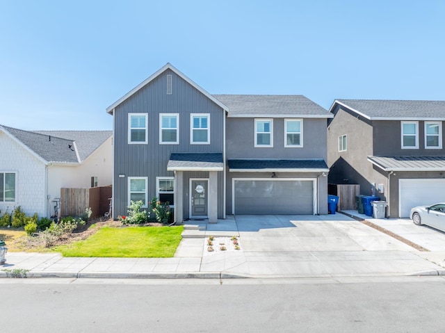 6569 E Lyell Ave, Fresno, CA 93727 - traditional-style house featuring a garage, driveway, and a shingled roof