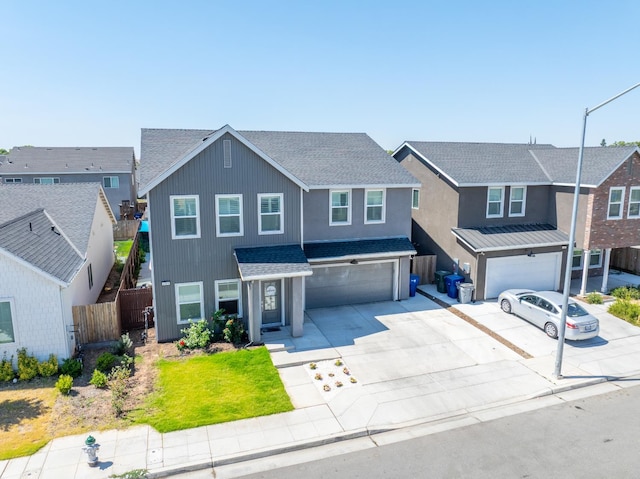 6569 E Lyell Ave, Fresno, CA 93727 - traditional-style home with an attached garage, a shingled roof, concrete driveway, and a residential view
