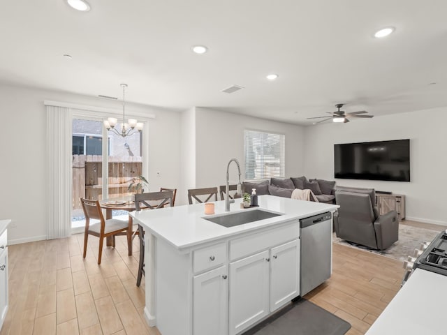 6274 E Riesling Dr, Fresno, CA 93727 - kitchen with dishwasher, light wood-type flooring, white cabinets, ceiling fan, and recessed lighting