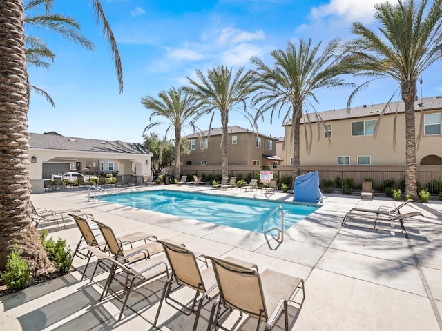 6274 E Riesling Dr, Fresno, CA 93727 - community pool featuring a patio area and a residential view