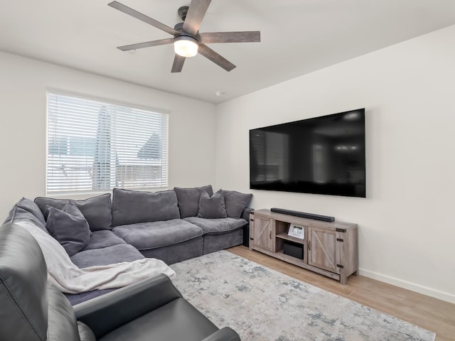 6274 E Riesling Dr, Fresno, CA 93727 - living area featuring a ceiling fan and light wood-style flooring