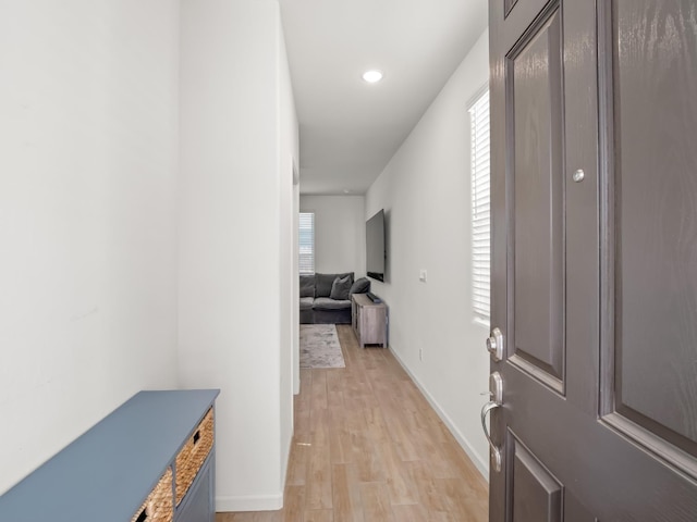 6274 E Riesling Dr, Fresno, CA 93727 - corridor with light wood finished floors, radiator heating unit, and recessed lighting