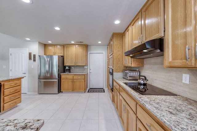3084 Magnolia Ave, Clovis, CA 93611 - kitchen with black appliances, under cabinet range hood, backsplash, light tile patterned floors, and light stone counters