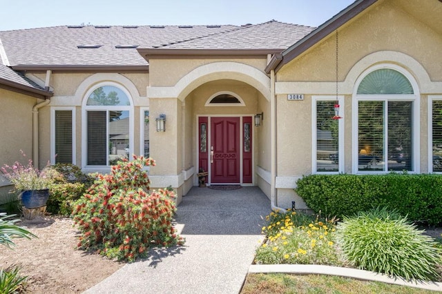 3084 Magnolia Ave, Clovis, CA 93611 - view of exterior entry featuring stucco siding and a shingled roof