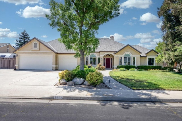 3084 Magnolia Ave, Clovis, CA 93611 - view of front facade with stucco siding, a garage, driveway, and a chimney