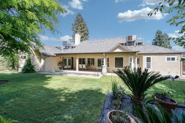 3084 Magnolia Ave, Clovis, CA 93611 - rear view of property with stucco siding, a lawn, and a chimney