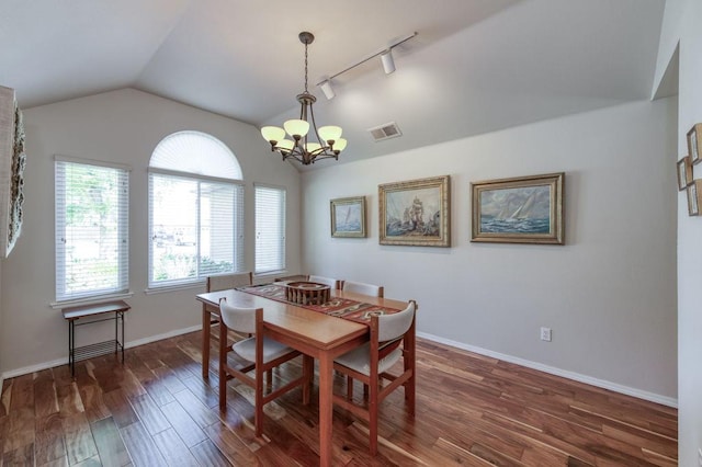3084 Magnolia Ave, Clovis, CA 93611 - dining area with track lighting, vaulted ceiling, healthy amount of natural light, a chandelier, and wood finished floors
