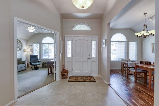 3084 Magnolia Ave, Clovis, CA 93611 - foyer with vaulted ceiling, a chandelier, a ceiling fan, and light tile patterned flooring