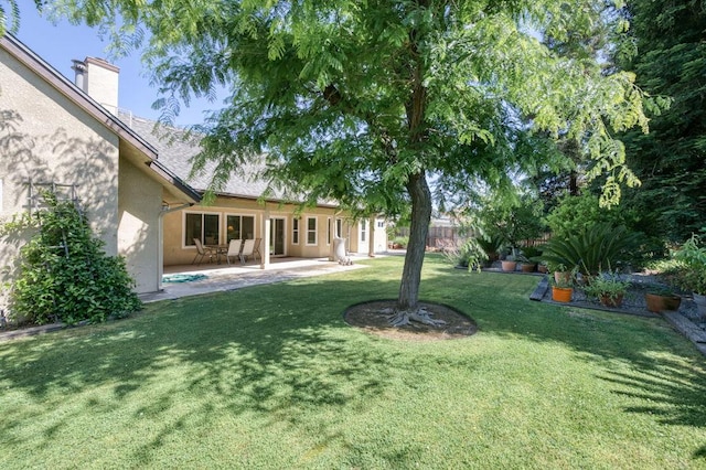 3084 Magnolia Ave, Clovis, CA 93611 - view of grassy yard with a patio