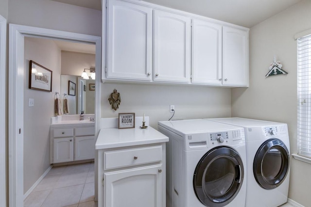 3084 Magnolia Ave, Clovis, CA 93611 - laundry room with cabinet space, washer and clothes dryer, and light tile patterned floors