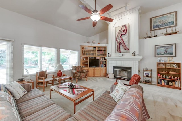 3084 Magnolia Ave, Clovis, CA 93611 - living area with light colored carpet, ceiling fan, a tile fireplace, and high vaulted ceiling