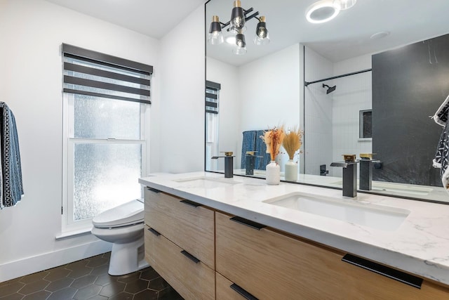 6054 N Kavanagh Ave, Fresno, CA 93711 - bathroom with double vanity, tile patterned flooring, a shower, and a chandelier