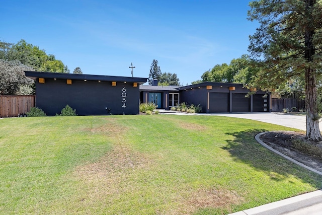 6054 N Kavanagh Ave, Fresno, CA 93711 - view of front facade with stucco siding, driveway, and an attached garage