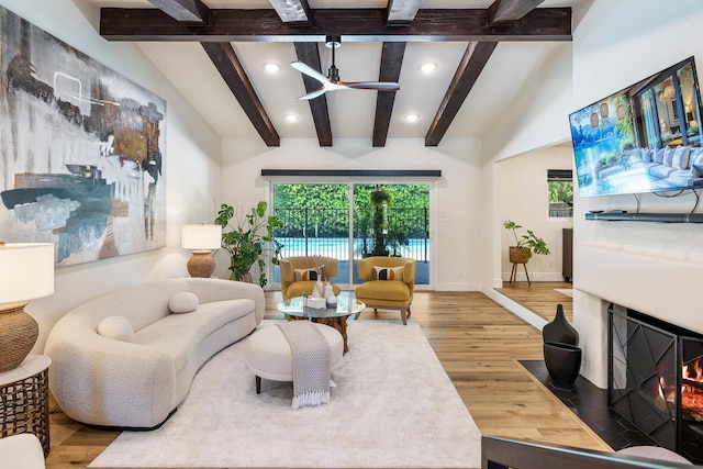 6054 N Kavanagh Ave, Fresno, CA 93711 - living room featuring ceiling fan, recessed lighting, wood finished floors, plenty of natural light, and a fireplace with flush hearth
