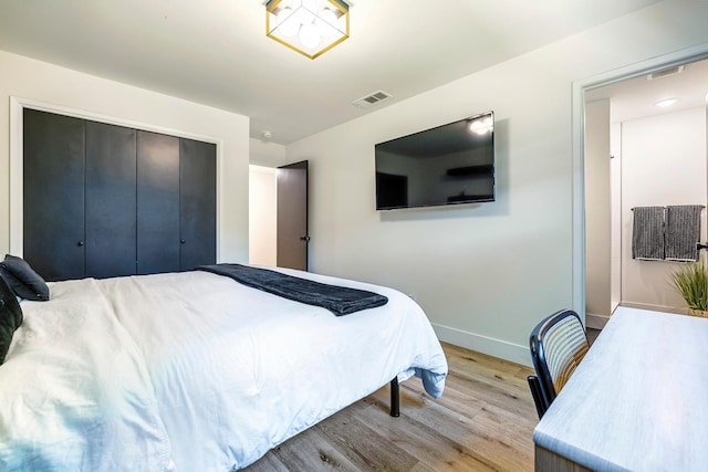 6054 N Kavanagh Ave, Fresno, CA 93711 - bedroom with light wood-style flooring and a closet