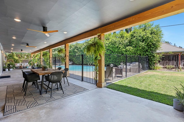6054 N Kavanagh Ave, Fresno, CA 93711 - fenced backyard featuring ceiling fan, a patio, and outdoor dining area