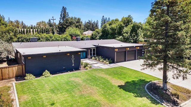 6054 N Kavanagh Ave, Fresno, CA 93711 - view of front of property featuring a garage, driveway, and stucco siding