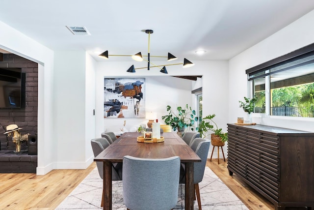 6054 N Kavanagh Ave, Fresno, CA 93711 - dining room with light wood-type flooring and baseboards