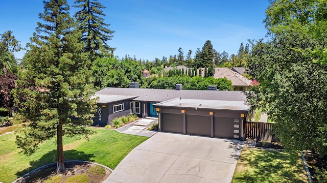 6054 N Kavanagh Ave, Fresno, CA 93711 - contemporary home with an attached garage and driveway