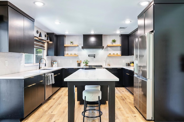 6054 N Kavanagh Ave, Fresno, CA 93711 - kitchen featuring custom exhaust hood, stainless steel appliances, open shelves, tasteful backsplash, and recessed lighting