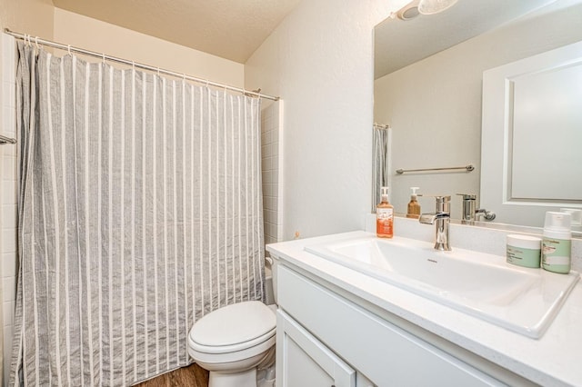 2012 Richard Ave, Sanger, CA 93657 - bathroom with vanity, wood finished floors, and a shower with shower curtain
