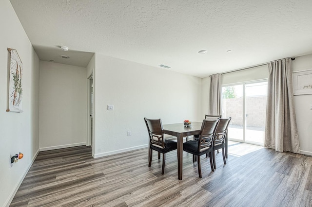 2012 Richard Ave, Sanger, CA 93657 - dining space featuring wood finished floors and a textured ceiling