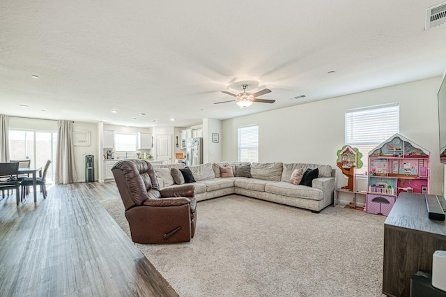 2012 Richard Ave, Sanger, CA 93657 - living area with plenty of natural light, ceiling fan, light wood-style flooring, and recessed lighting