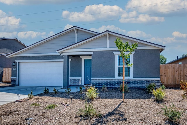 2012 Richard Ave, Sanger, CA 93657 - view of front of property with driveway, an attached garage, brick siding, and covered porch