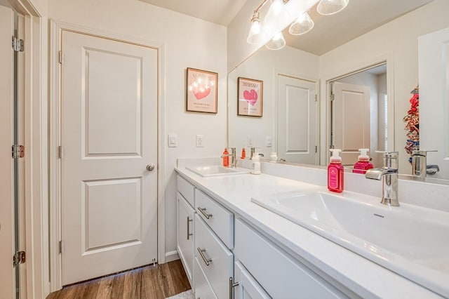 2012 Richard Ave, Sanger, CA 93657 - full bath featuring double vanity and wood finished floors