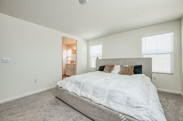 2012 Richard Ave, Sanger, CA 93657 - carpeted bedroom with baseboards and ensuite bath