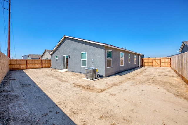 2012 Richard Ave, Sanger, CA 93657 - rear view of house with stucco siding and a fenced backyard