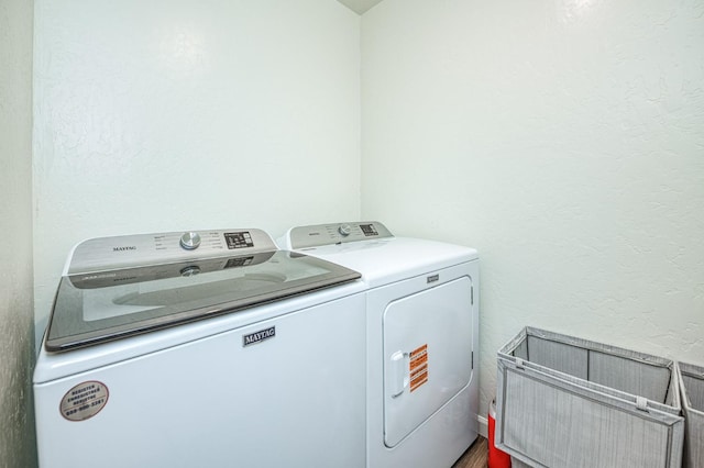 2012 Richard Ave, Sanger, CA 93657 - washroom featuring washer and dryer and a textured wall