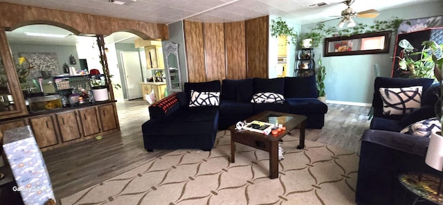 3415 E Lincoln Ave, Fresno, CA 93725 - living room featuring wood finished floors, arched walkways, and ceiling fan