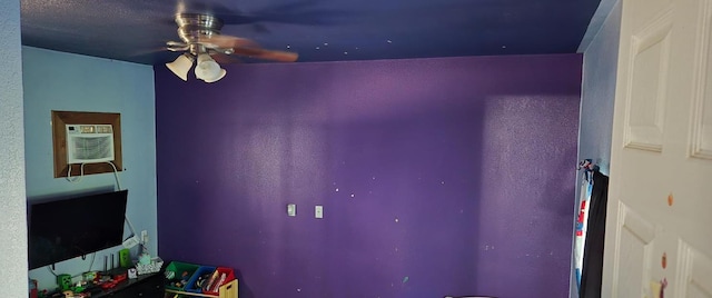 3415 E Lincoln Ave, Fresno, CA 93725 - unfurnished bedroom featuring ceiling fan and a wall mounted air conditioner