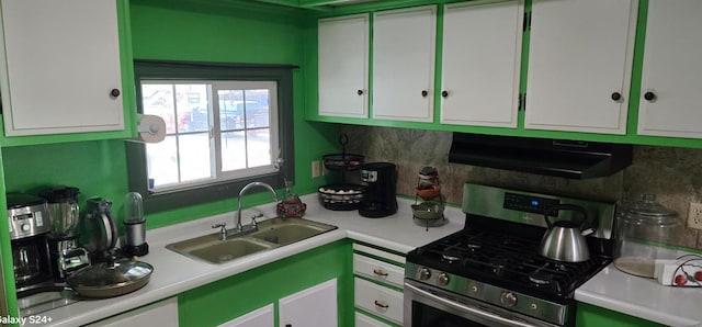 3415 E Lincoln Ave, Fresno, CA 93725 - kitchen featuring gas stove, range hood, white cabinets, light countertops, and backsplash