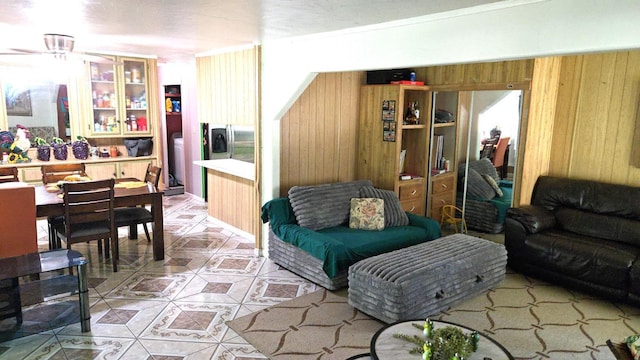 3415 E Lincoln Ave, Fresno, CA 93725 - living area with wood walls and light tile patterned flooring