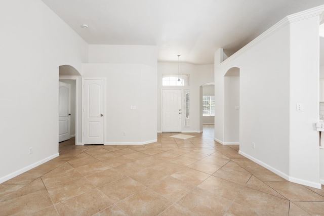 5647 N Tracy Ave, Fresno, CA 93722 - unfurnished room featuring arched walkways and light tile patterned floors