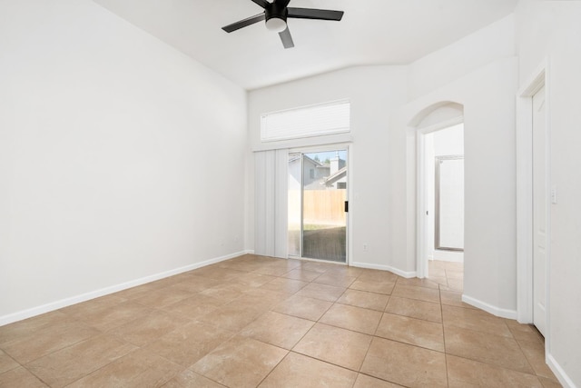 5647 N Tracy Ave, Fresno, CA 93722 - empty room featuring ceiling fan, light tile patterned flooring, lofted ceiling, and arched walkways