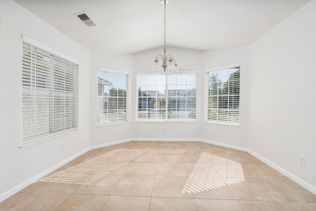 5647 N Tracy Ave, Fresno, CA 93722 - unfurnished dining area with light tile patterned floors, a chandelier, and lofted ceiling