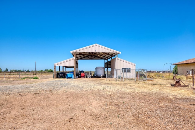 3377 N Bryan Ave, Fresno, CA 93723 - view of outdoor structure with a carport and dirt driveway