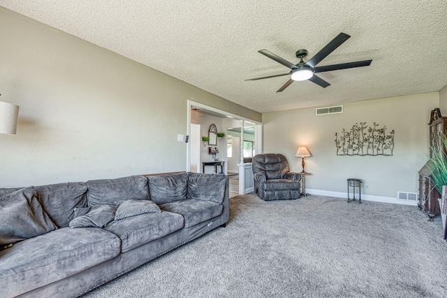 3377 N Bryan Ave, Fresno, CA 93723 - living room with a ceiling fan, a textured ceiling, and carpet flooring