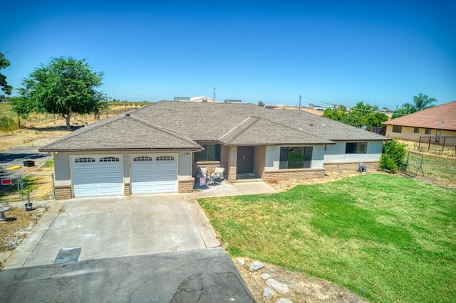 3377 N Bryan Ave, Fresno, CA 93723 - ranch-style house featuring concrete driveway, an attached garage, roof with shingles, and brick siding